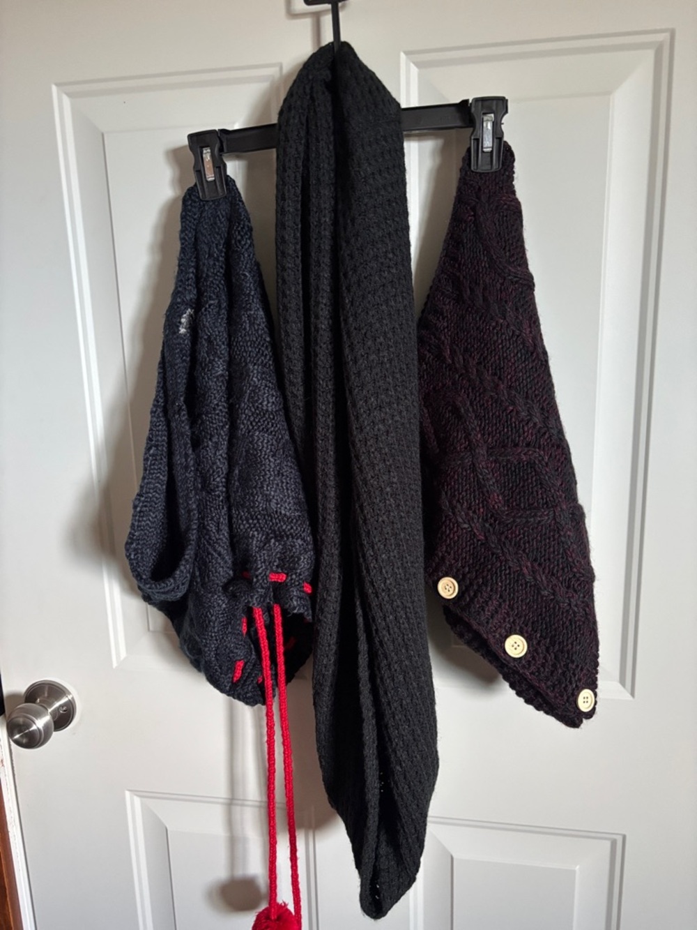 Three crochet scarves.